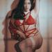 Minneapolis dominatrix Mistress Misa Mizuhara poses in red lingerie.
